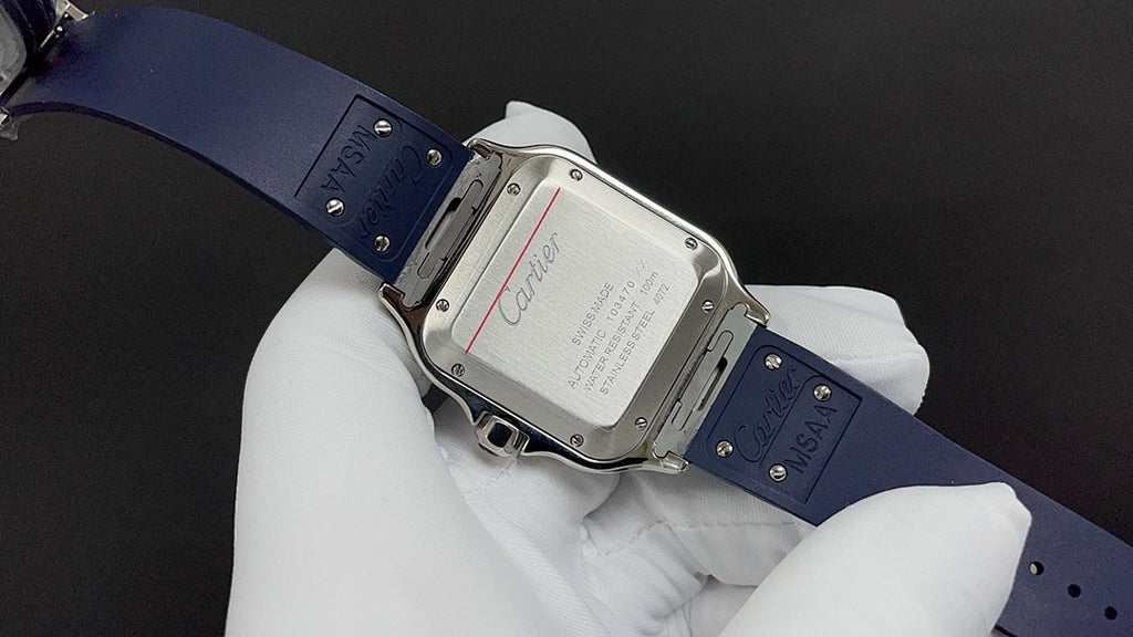 Cartier watch clasp and caseback on blue strap, metal buckle and engraved back