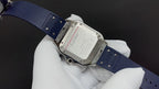 Cartier watch clasp and caseback on blue strap, metal buckle and engraved back