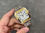 Cartier rectangular watch on metal bracelet with gold bezel and roman numeral dial