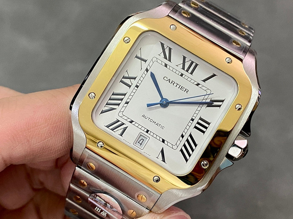 Cartier rectangular watch with gold-and-steel frame, roman numeral dial, blue hands