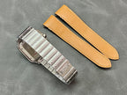 Metal watch clasp with two tan leather straps