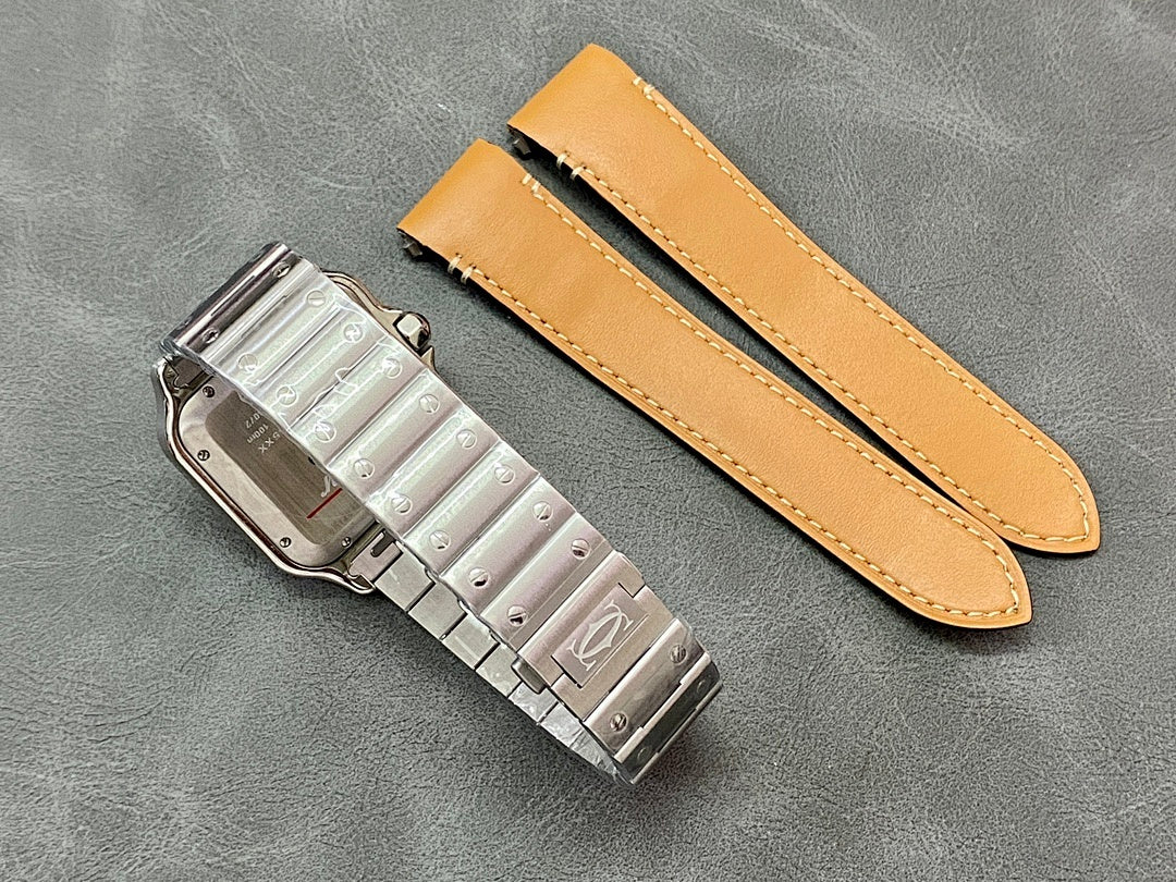 Metal watch clasp with two tan leather straps