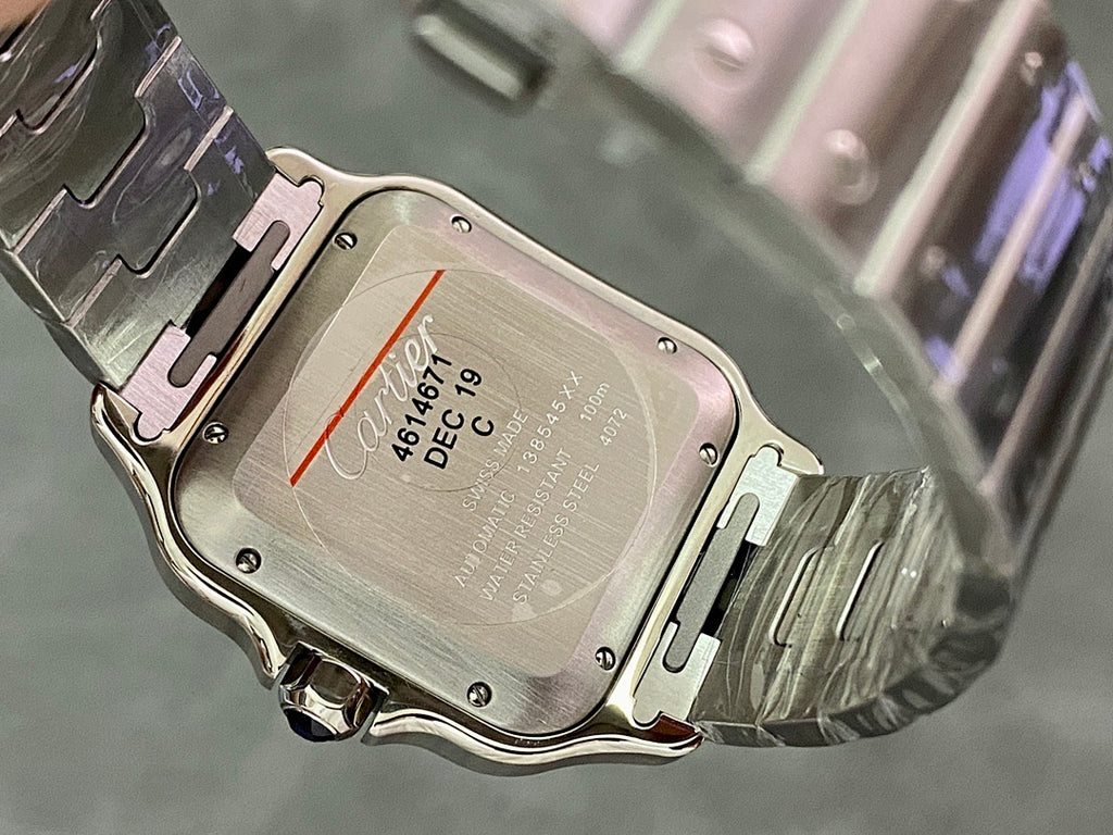 Silver watch case back with engraved markings and date window