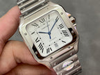 Square silver Cartier wristwatch close-up of Roman numeral dial