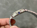 Cartier Santos watch crown side with blue bezel detail