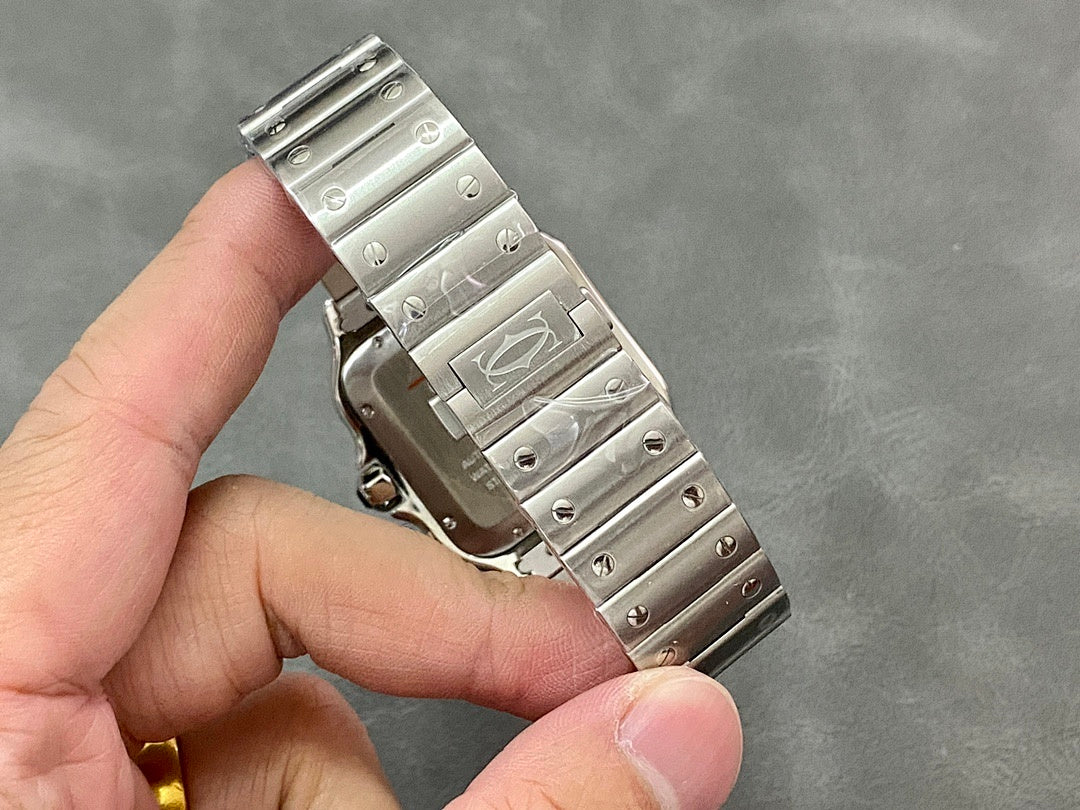 Wristwatch bracelet with silver metal links and visible screw details, held in hand