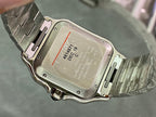Wristwatch case back with engraved markings and steel clasp, viewed from above