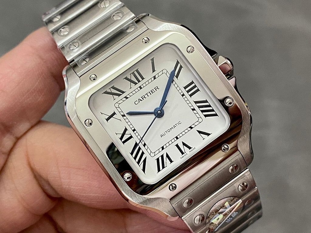 Close-up of Cartier watch face with white dial, Roman numerals, and blue seconds hand