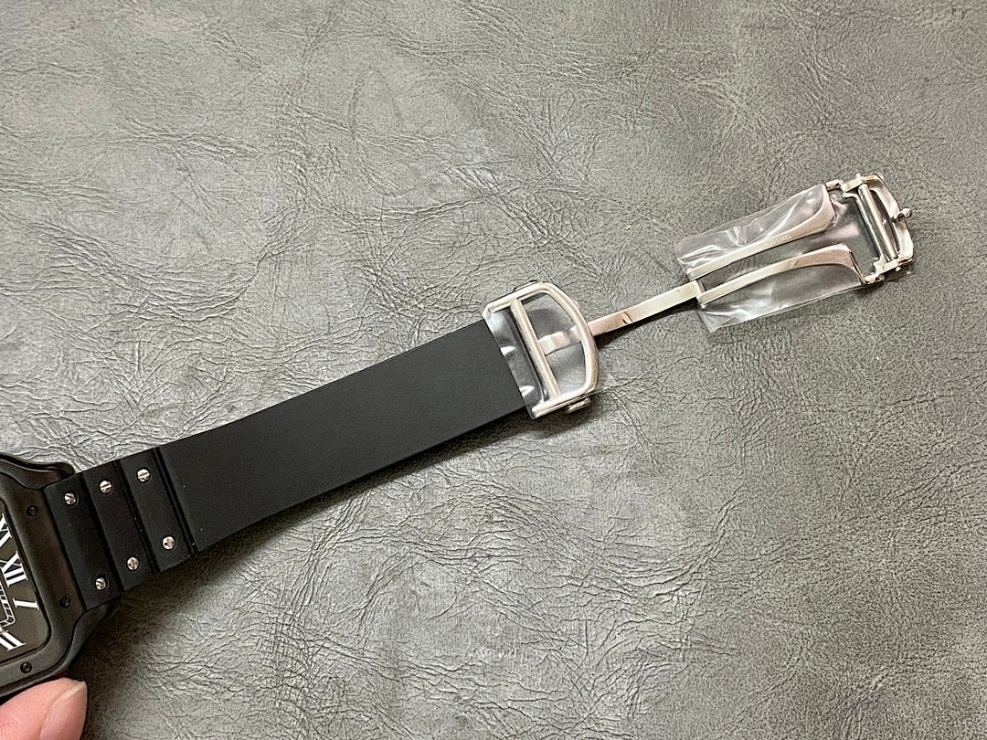 Cartier watch clasp with black strap and silver buckle hardware.