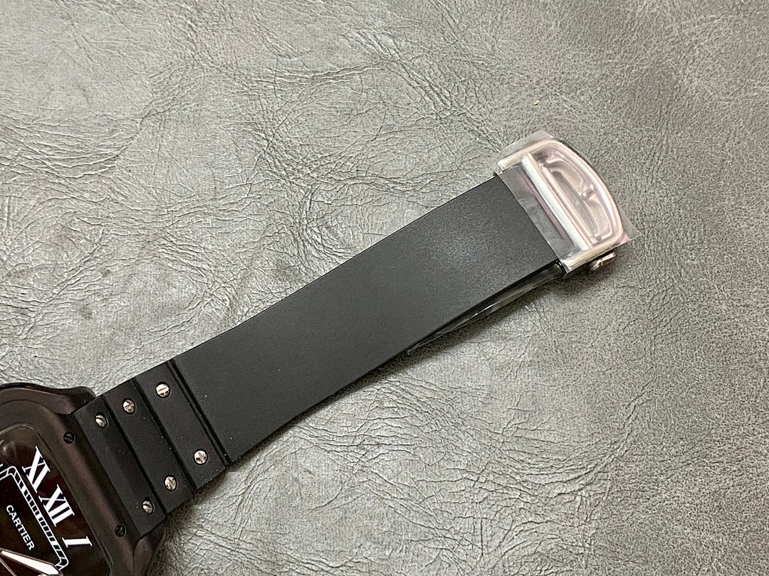 Cartier watch strap end with black band and silver buckle.