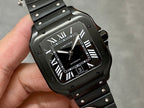 Cartier watch front with black dial, Roman numerals, date window, and metal bezel.