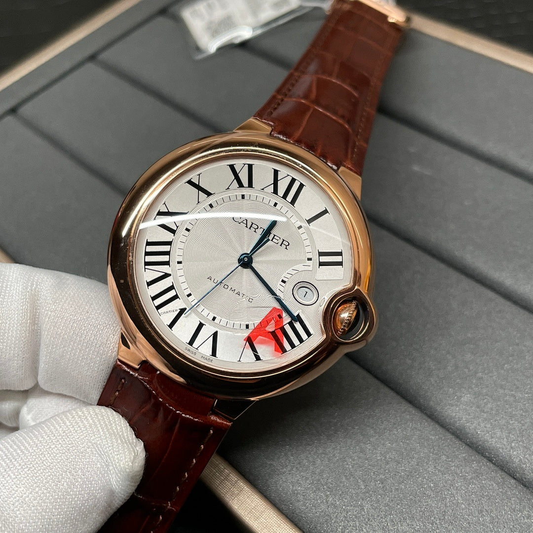 Cartier wristwatch on white glove with brown leather strap and Roman numeral dial