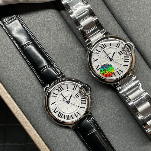 Cartier watch pair with silver metal bracelets, round white dials and Roman numeral markings
