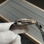 Stainless-steel Cartier watch case with polished bezel and crown, side profile