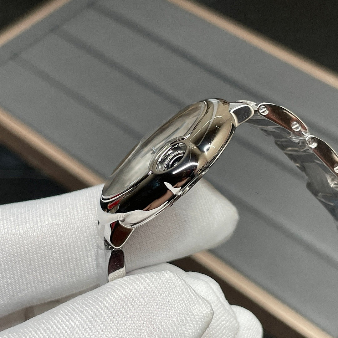 Stainless-steel Cartier watch case with crown and curved bezel, side view