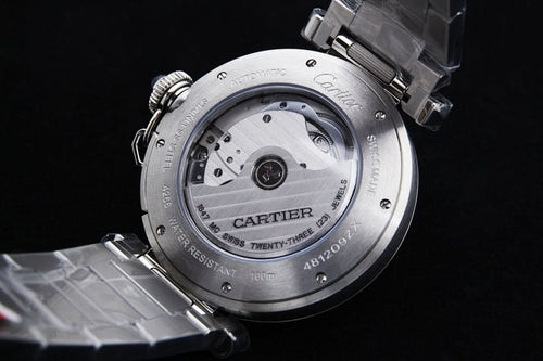 Cartier watch caseback with screw details and engraved markings, silver finish
