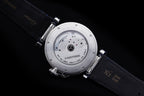 Cartier wristwatch underside view with visible movement and dark blue leather strap