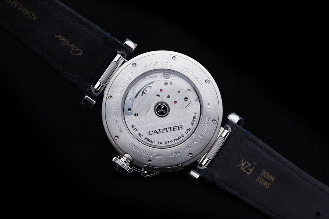 Cartier wristwatch underside view with visible movement and dark blue leather strap