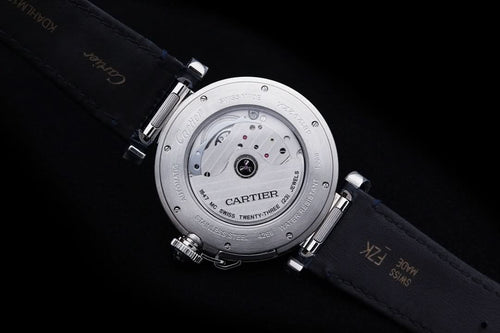 Cartier wristwatch underside view with visible movement and dark blue leather strap