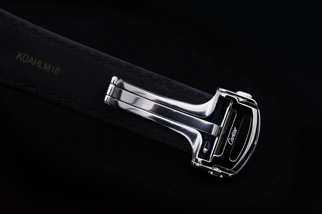 Cartier wristwatch with stainless clasp and dark blue leather strap, side profile