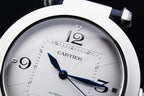 Cartier wristwatch face close-up with white dial and blue hour and minute hands