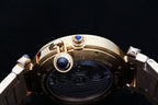 Cartier watch crown and pushers with blue jewel on gold-tone caseback