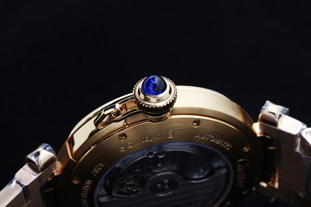 Cartier watch blue jeweled crown on gold-tone caseback, detailed controls
