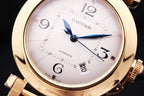 Gold-tone Cartier watch dial with Roman numerals and blue automatic hands