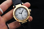 Cartier watch with white dial, gold-tone case, black leather strap and crown