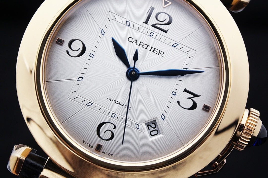 Cartier watch front view with white dial, blue hands, gold-tone case and leather strap