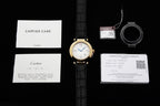 Cartier watch with black leather strap and included care and warranty documents