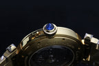 Cartier gold-tone watch bezel with blue gemstone setting and case back view.