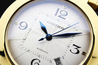 Close-up of Cartier white dial with blue hour/minute hands and Arabic numerals.