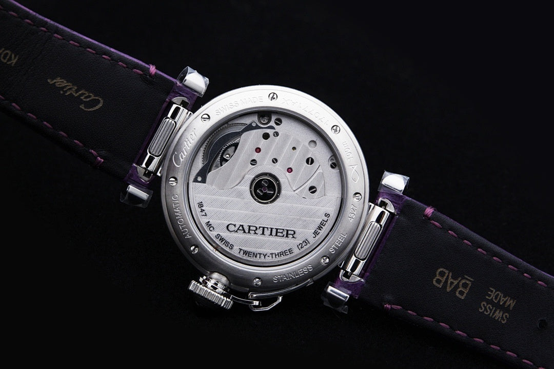 Cartier watch caseback on purple leather strap, engraved metal back plate