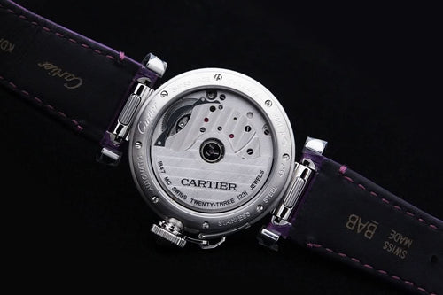 Cartier watch caseback on purple leather strap, engraved metal back plate