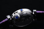 Cartier watch underside with blue jewel, purple leather strap and metal case