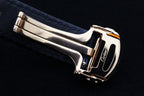 Cartier watch side view with gold case and blue leather strap