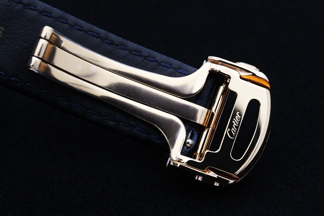 Cartier watch side view with gold case and blue leather strap