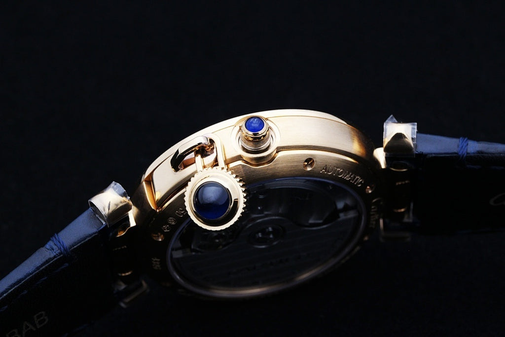 Cartier watch case with blue leather strap and gold crown and blue details