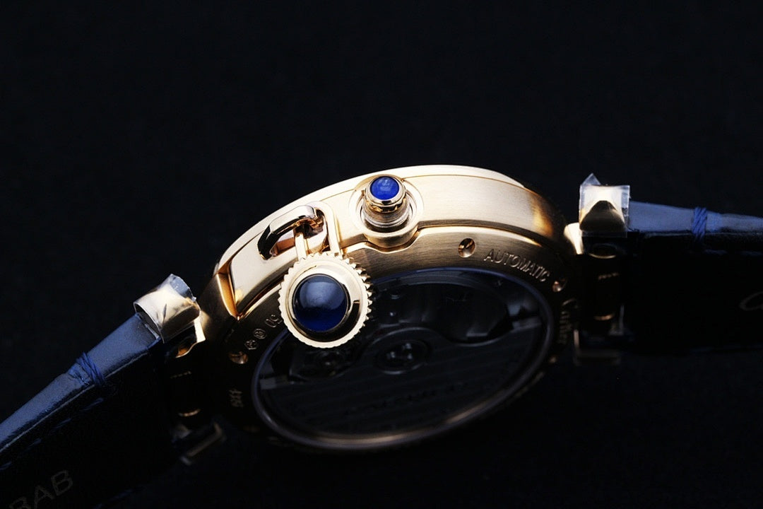Cartier watch case with blue leather strap and gold crown and blue details