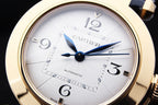 Cartier watch close-up of white dial, blue hands, gold bezel, Roman numerals