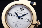 Cartier watch face close-up with white dial, blue hands and Roman numerals