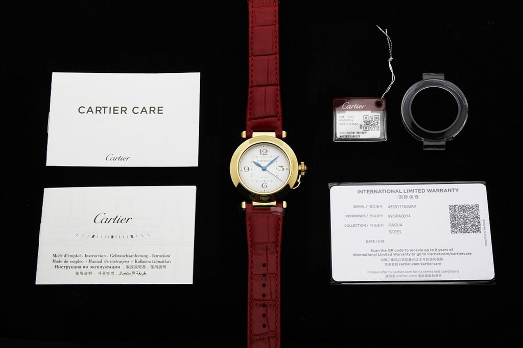 Cartier watch with red leather strap plus care and warranty documents and tag