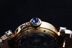 Gold wristwatch crown with blue gemstone and part of metal bracelet