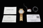 Gold wristwatch with linked bracelet and included warranty and care documents