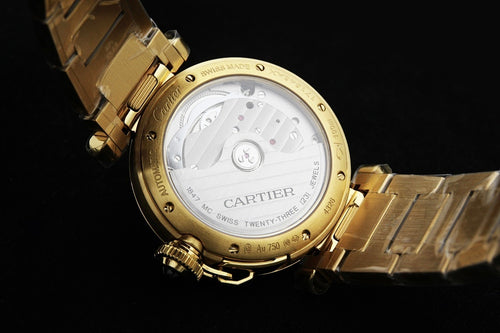 Gold-tone watch back with engraved case and metal bracelet links