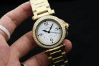 Gold-tone Cartier wristwatch with crystal bezel, white dial, and metal bracelet