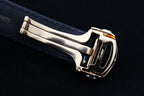 Cartier watch with blue leather strap and gold-tone metal buckle clasp, side view