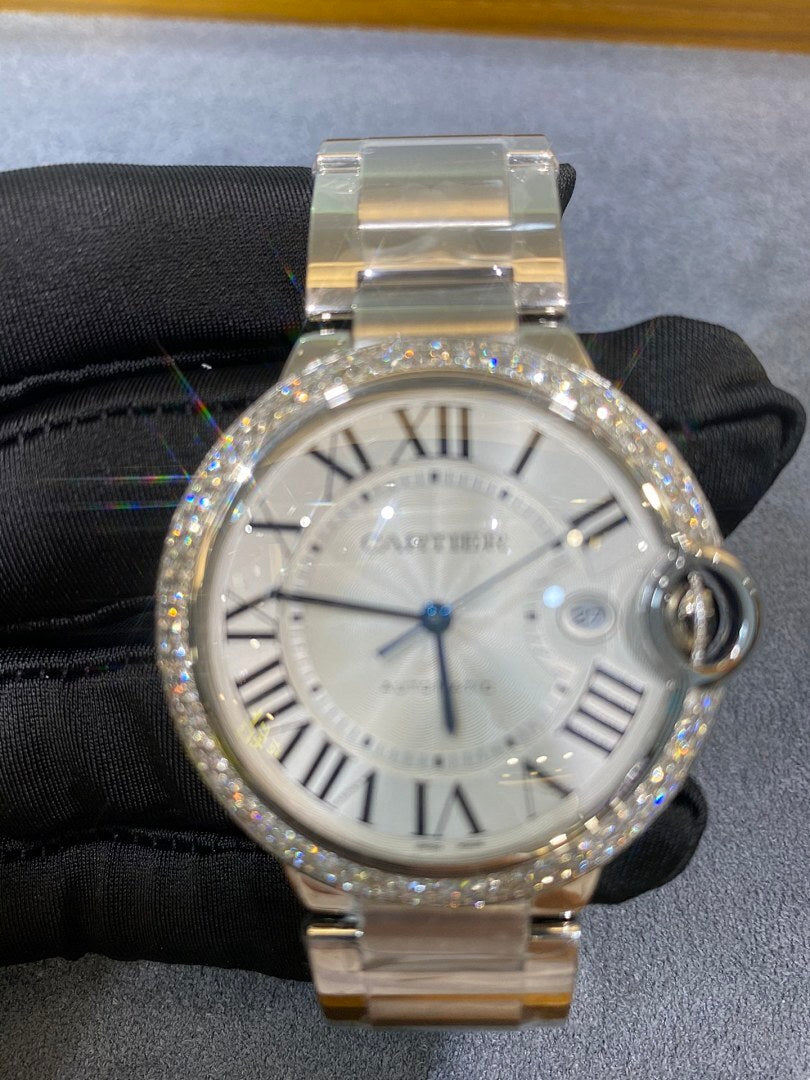 Silver diamond bezel wristwatch with white dial, Roman numerals and blue seconds hand