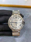 Silver wristwatch with diamond bezel, Roman numeral dial and metal link bracelet